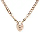 AN ANTIQUE HEART PADLOCK NECKLACE in 9ct yellow gold, comprising a curb chain, suspending a heart