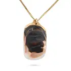 A LARGE VINTAGE MOTHER OF PEARL PENDANT NECKLACE the pendant set with a large section of mother of