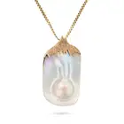A LARGE VINTAGE MOTHER OF PEARL PENDANT NECKLACE the pendant set with a large section of mother of