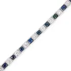 AN ART DECO SAPPHIRE AND DIAMOND LINE BRACELET comprising a row of alternating French cut
