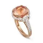 OSCAR FRIEDMAN, A MORGANITE AND DIAMOND CLUSTER RING set with a round cut morganite of 6.31 carats