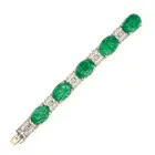 A CHINESE CARVED JADEITE JADE AND DIAMOND BRACELET set with five Chinese carved jadeite jade