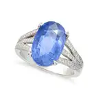 A SAPPHIRE AND DIAMOND DRESS RING in platinum, set with an oval cut sapphire of approximately 4.02