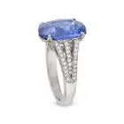 A SAPPHIRE AND DIAMOND DRESS RING in platinum, set with an oval cut sapphire of approximately 4.02