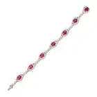 A FINE FANCY COLOURED SAPPHIRE AND DIAMOND BRACELET in 18ct white gold, comprising seven navette