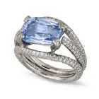 A 7.12 CARAT CEYLON NO HEAT SAPPHIRE AND DIAMOND RING set with a cushion cut sapphire of 7.12