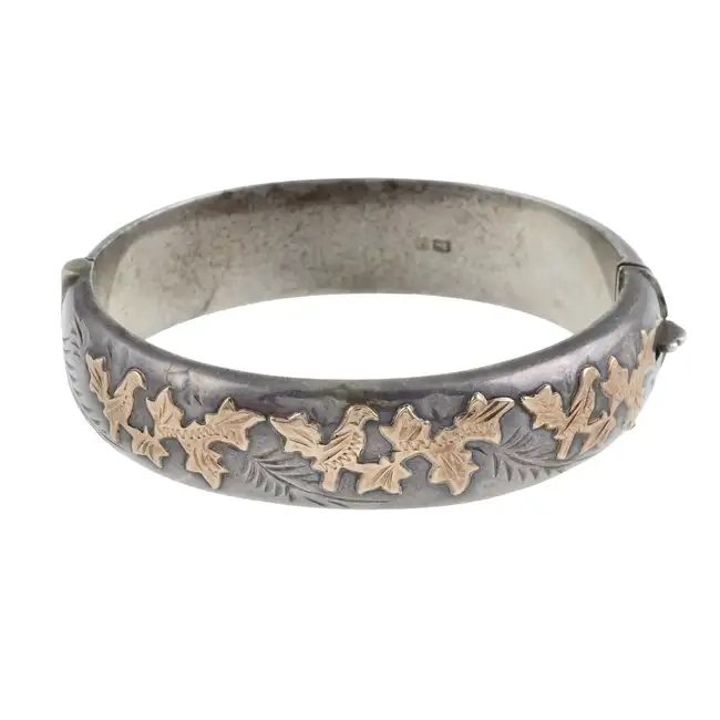 Silver bicolour foliate hinged bangle