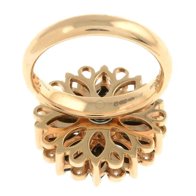 18ct gold diamond & black gem floral spinner ring