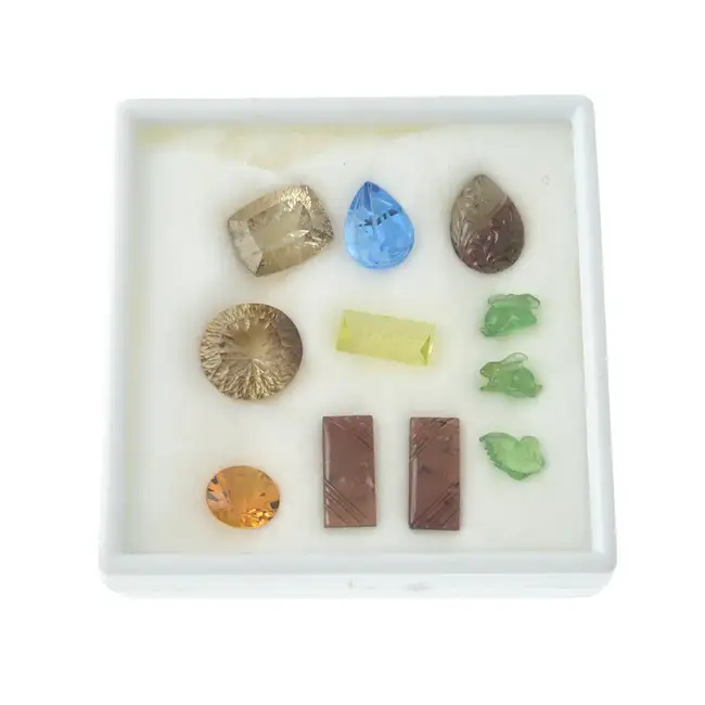 Assorted fantasy-cut & carved gemstones, 108.35ct