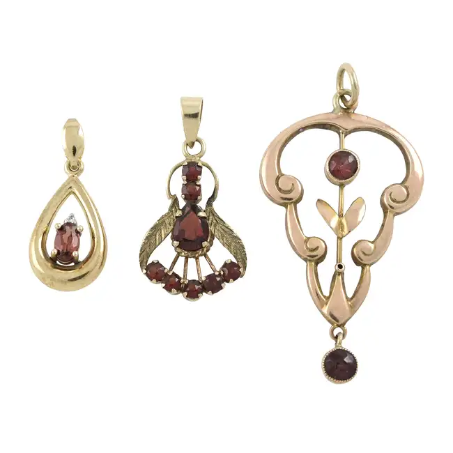 Three garnet pendants