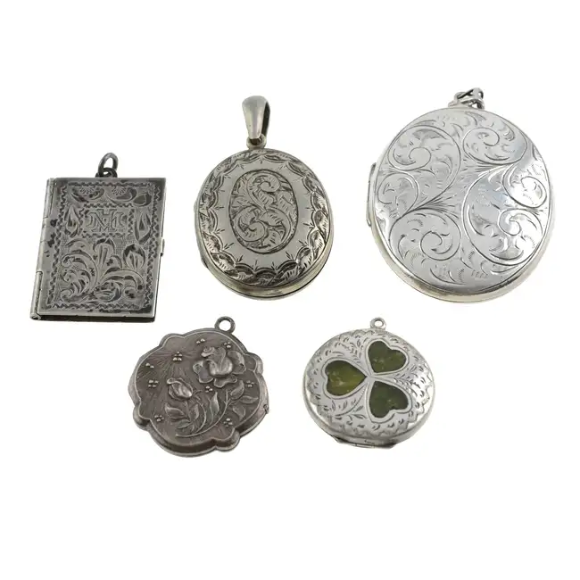 Five assorted mid 20th century locket pendants