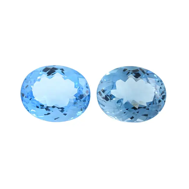 Two oval-shape blue topazes, 67.14ct
