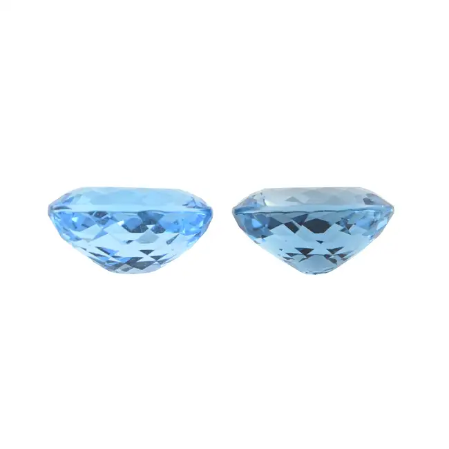 Two oval-shape blue topazes, 67.14ct