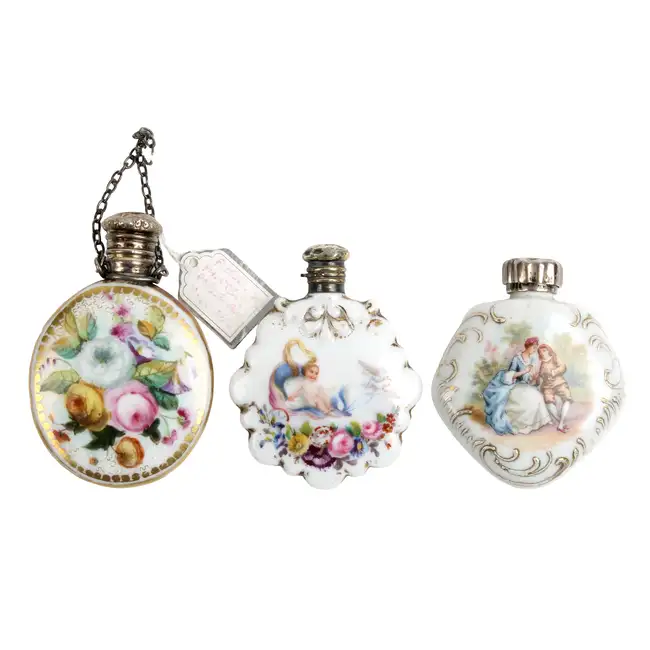 Three scent bottles, one with floral spray