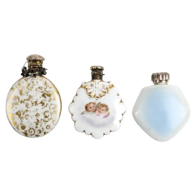 Three scent bottles, one with floral spray