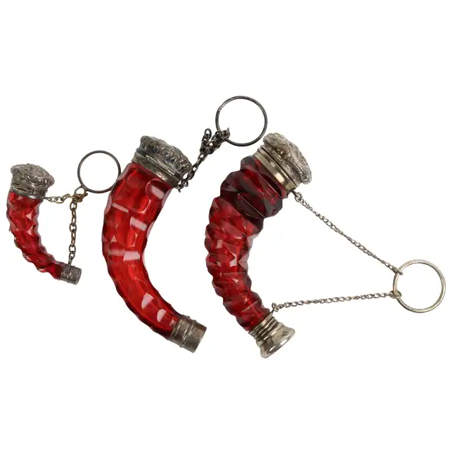 Three ruby glass horn or cornucopia scent bottles