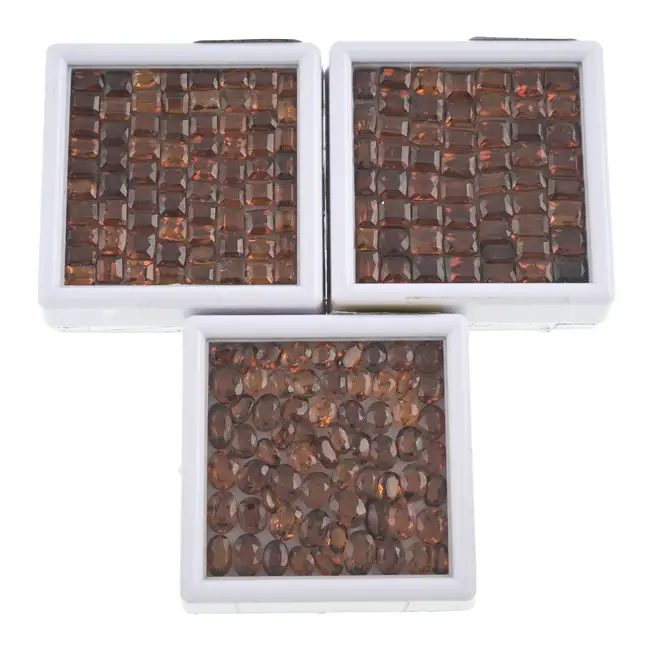 Vari-shape orange garnets, 138.97ct