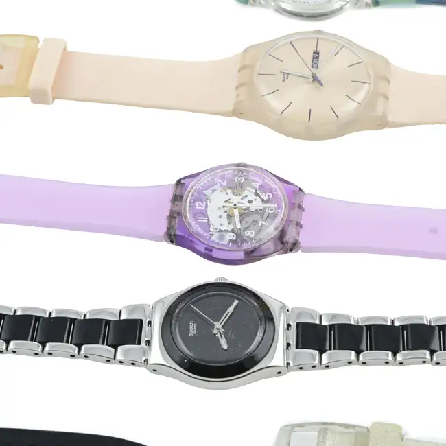 Eighteen Swatch watches