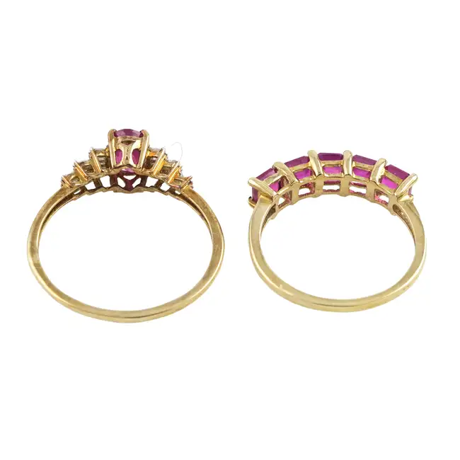 Two 9ct gold glass-filled ruby rings