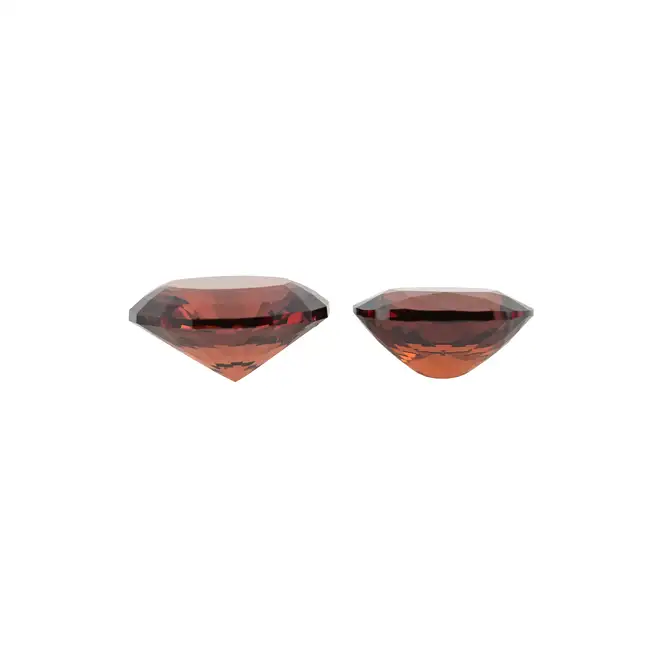 Two oval-shape orangy-red garnets, 4.03ct