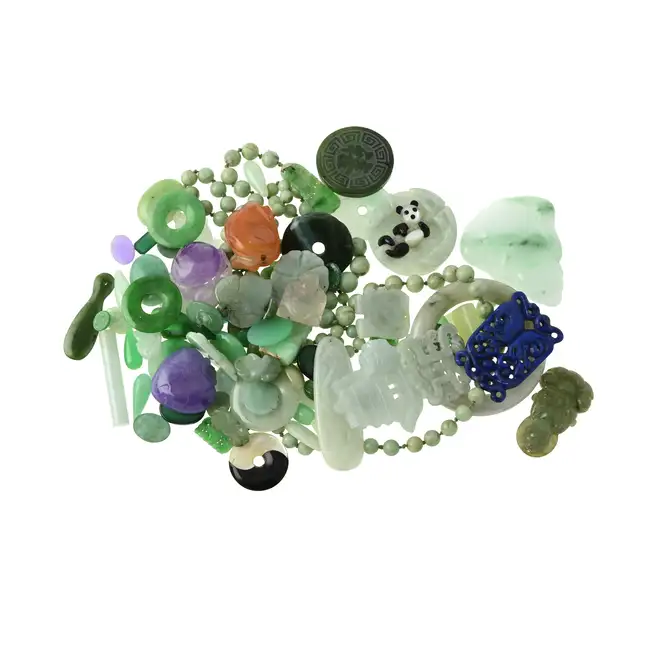 Selection of carvings, cabochons & beads, 457.00g