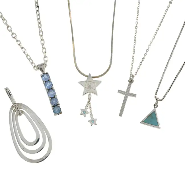 Four pendants, three chains & a charm bracelet