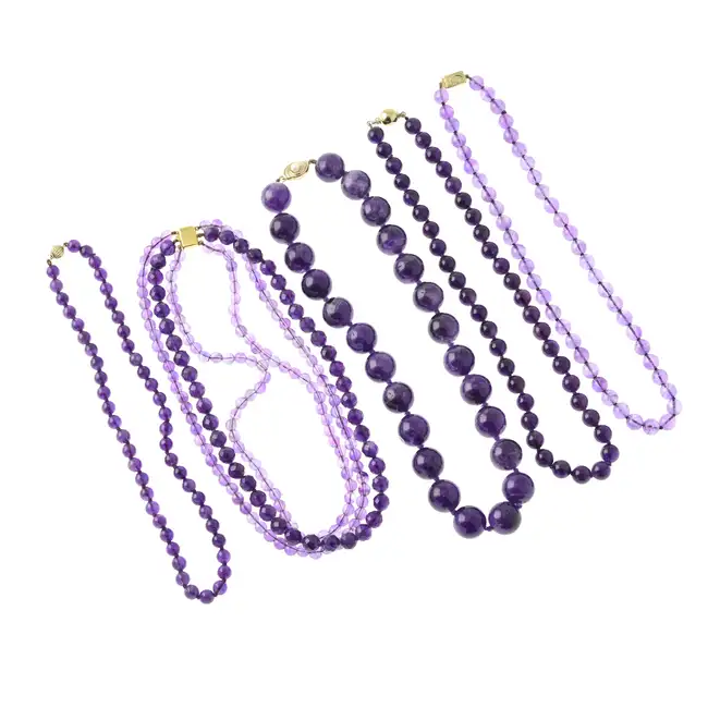 Five assorted amethyst necklaces