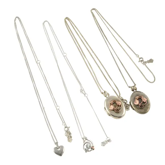 Four pendants, with chains, by Clogau