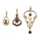 Three garnet pendants