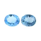 Two oval-shape blue topazes, 67.14ct