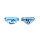 Two oval-shape blue topazes, 67.14ct
