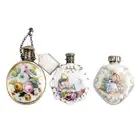 Three scent bottles, one with floral spray
