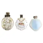 Three scent bottles, one with floral spray