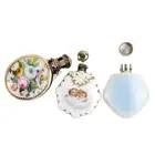 Three scent bottles, one with floral spray