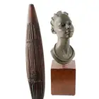 An African bust and a modern hardwood paddle