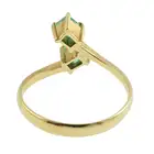 Emerald two-stone crossover dress ring