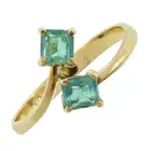 Emerald two-stone crossover dress ring
