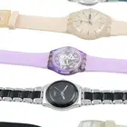 Eighteen Swatch watches