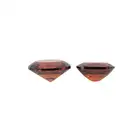 Two oval-shape orangy-red garnets, 4.03ct