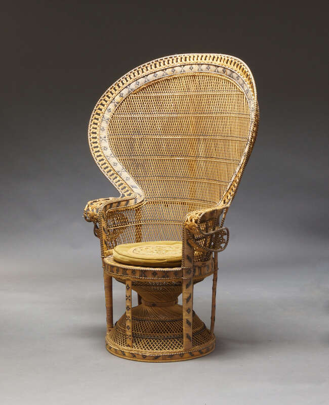 
	
		A rattan and caned fan back peacock chair, c.1970s, sometimes referred to as an...
