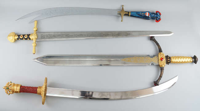 
	
		A group of four fantasy  display swords, of modern manufacture, to comprise a scimitar...