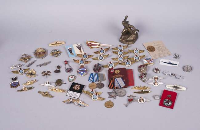 
	
		A quantity of Russian WWII and post war medals and badges, including: a pair of medals...
