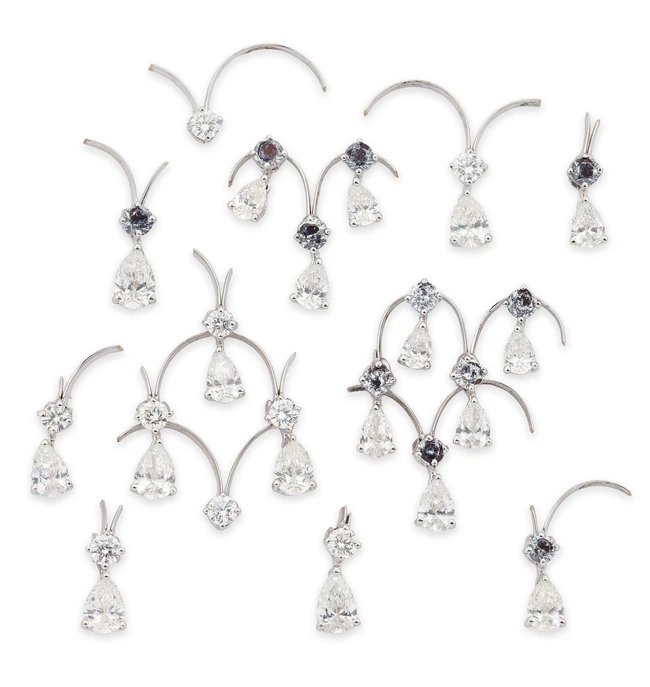 A group of diamond set components, probably from a fringe necklace some set with pear-shaped...