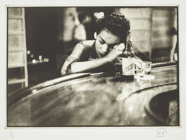 
	
		Eve Arnold OBE Hons FRPS, 
		American, 1912-2012- 
		Bargirl in brothel in the red...