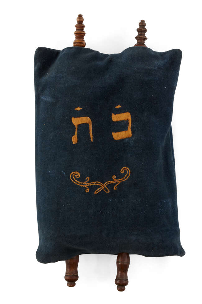 
	
		A miniature 18th century Sefer Torah scroll mounted on carved wooden rollers, possibly...