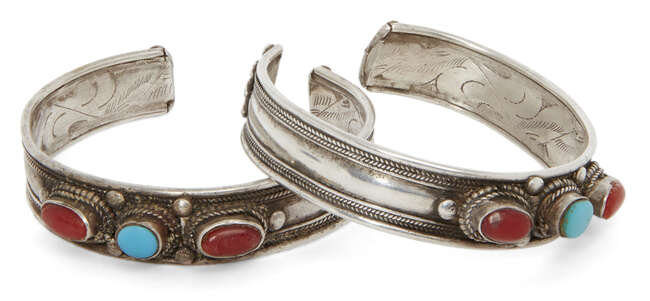 
	
		Two coral and turquoise set silver cuff bracelets, India, 20th century, each with three...