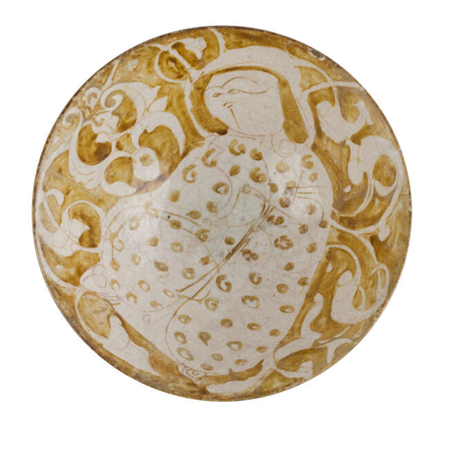 
	
		 
		A Kashan lustre bowl with a seated figure, Iran, circa 1200, of deep conical form...