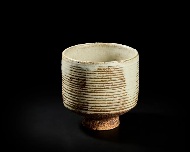 Mansimran Singh (Indian B. 1939),
High footed bowl with grooves and pale glaze, signed below...