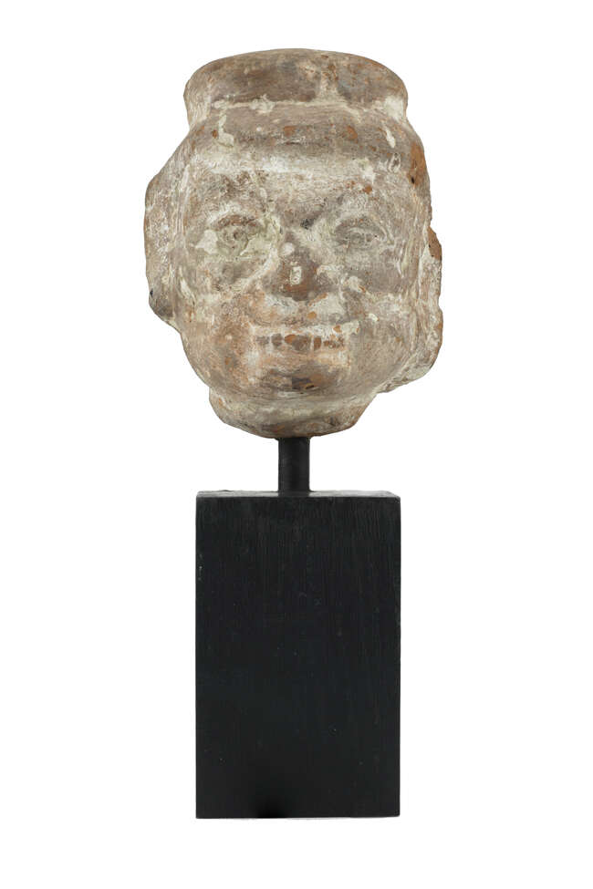 
	
		A Gupta period terracotta head, India, circa 4th century, depicted with wide set eyes, a...