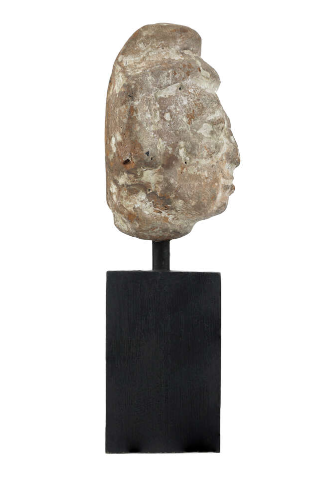
	
		A Gupta period terracotta head, India, circa 4th century, depicted with wide set eyes, a...